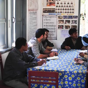 Adam, with Country Director Leslie Engle, in a planning meeting with the educators and elders of Xienglohm Village.