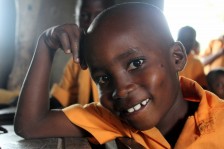 A primary school student, smiling bashfully, at Have-Glime.